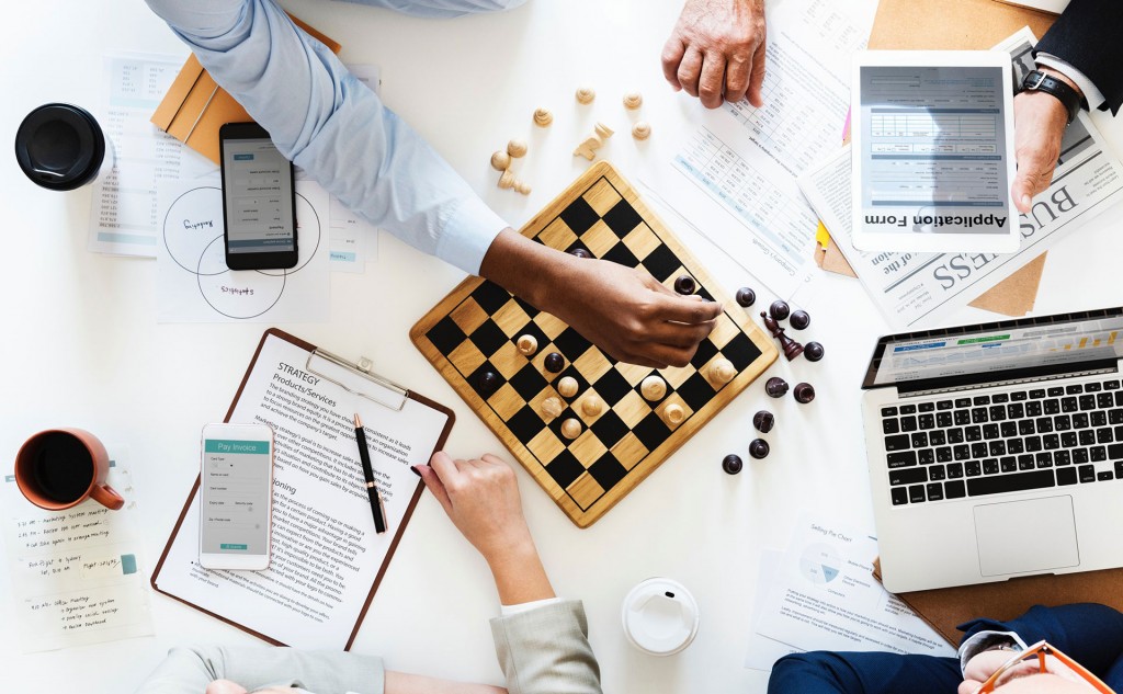 People playing chess on a table