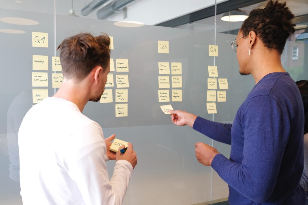 Team members building a Strategic Plan with sticky notes in the office